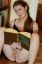 шатенка, сидит, лобок, справочник, книга, полки, улыбка
